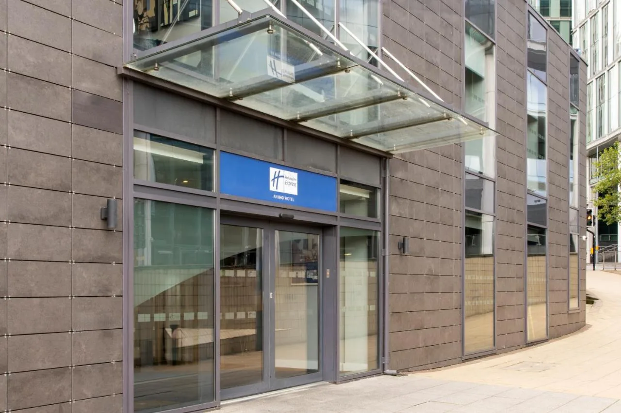 an entrance to a building with a revolving door at Holiday Inn Express Birmingham - Snow Hill by IHG in Birmingham